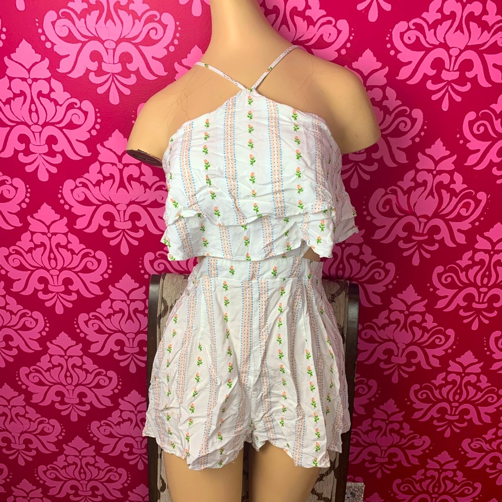 Forever 21 Floral romper with unique cut outs. Women’s small